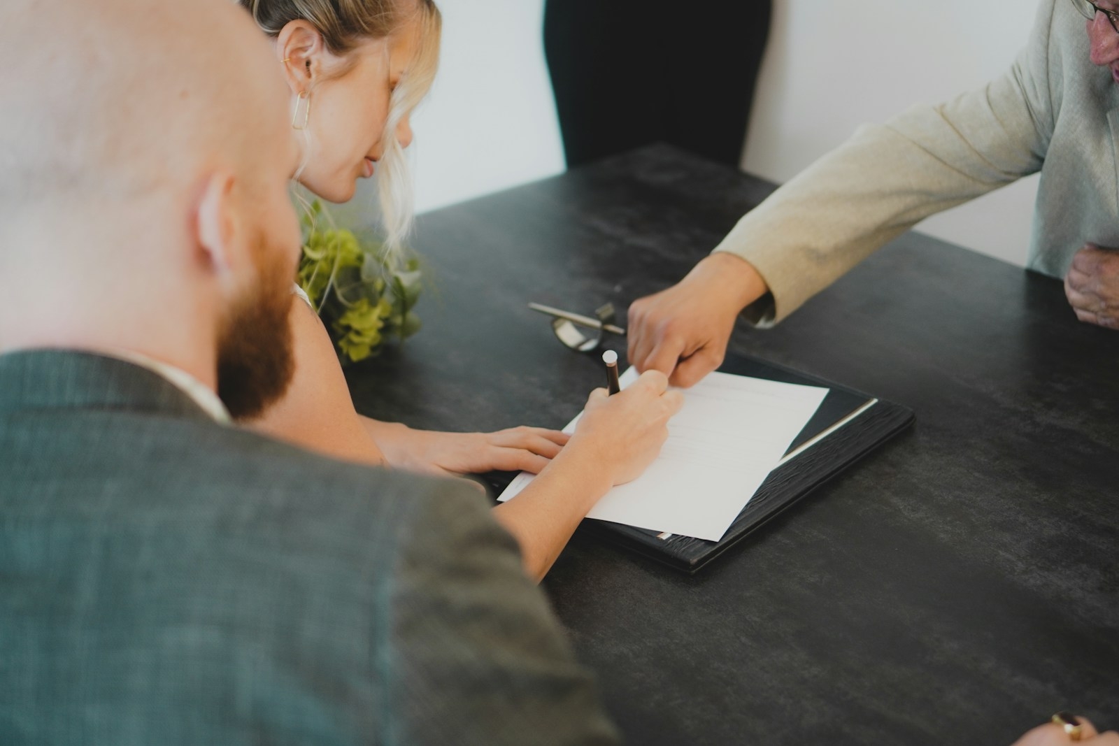 A couple reviewing and signing documents